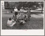 Group of people sitting in square in front of courthouse, Tahlequah, Oklahoma