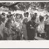 Revivalist surrounded by speculators at rally under trees in square, Saturday afternoon, Tahlequah, Oklahoma