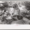 Little girl and her baby brother reading Bible, community camp, Oklahoma City, Oklahoma