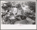 Little girl and her baby brother reading Bible, community camp, Oklahoma City, Oklahoma