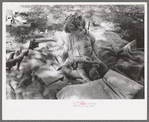 Little girl and her baby brother reading Bible, community camp, Oklahoma City, Oklahoma