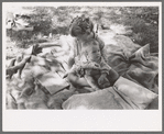Little girl and her baby brother reading Bible, community camp, Oklahoma City, Oklahoma
