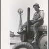 Mr. Germeroth, Farm Security Administration client sitting on tractor which was bought by means of FSA loan, Sheridan County, Kansas