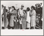 Spectators behind the fence at 4-H Club fair, Cimarron, Kansas