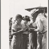 Distributing pie to contestants in pie eating contest, 4-H Club fair, Cimarron, Kansas