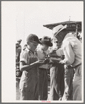 Distributing pie to contestants in pie eating contest, 4-H Club fair, Cimarron, Kansas