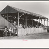The grandstand at former county fairgrounds filled with spectators at the 4-H Club fair, Cimarron, Kansas