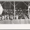 Spectators in the grandstand at 4-H club fair, Cimarron, Kansas