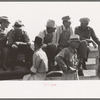 Farmers sitting on the fence at 4-H Club fair, Cimarron, Kansas