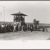 Judges stand occupied by spectators at 4-H Club fair, Cimarron, Kansas