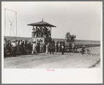Judges stand occupied by spectators at 4-H Club fair, Cimarron, Kansas