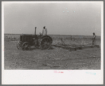 Tractor-drawn floater on Gray County farm, Kansas