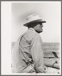 One of the Davidson brothers who own a cooperative well made possible by FSA (Farm Security Administration) loan, Gray County, Kansas