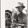 One of the Davidson brothers who own a cooperative well made possible by FSA (Farm Security Administration) loan, Gray County, Kansas