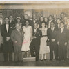 Attendees at a cultural program honoring Cuban declamdora Eusebia Cosme (fourth from left, front row), with Alberto Socarras (standing on Cosme's left), and other guests