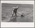 Mr. Johnson, F.S.A. client with part interest in cooperative well irrigating his fields near Syracuse, Kansas