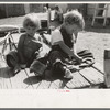 Children of Spanish American farm family playing on wagon, Taos County, Okla. [sic]