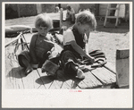 Children of Spanish American farm family playing on wagon, Taos County, Okla. [sic]