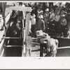 Spectators at Bean Day rodeo, Wagon Mound, N.M