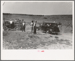 Paying admission fee at Bean Day rodeo, Wagon Mound, New Mexico