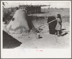 General view of oven for bread baking on Spanish-American farm in Taos, N.M