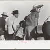Spectators at Bean Day rodeo, Wagon Mound, N.M