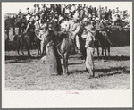 Cowboys talking, Bean Day rodeo, Wagon Mound, N.M