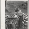 Splitting wood, getting ready for the winter, on farm near Bradford, Vermont