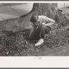 Boy getting ready to burn leaves, Meriden, Conn