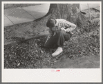 Boy getting ready to burn leaves, Meriden, Conn