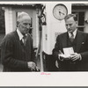 Filling station operator talking to traveler near North Hampton, Mass