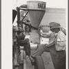 Farmer talking with salesman of agricultural machinery at Jacksonville, Texas