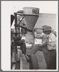 Farmer talking with salesman of agricultural machinery at Jacksonville, Texas