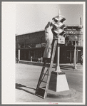 Painting traffic lights, Taylor, Texas