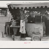 Dishwasher at hamburger stand, county fair, Gonzales, Texas