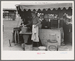 Dishwasher at hamburger stand, county fair, Gonzales, Texas