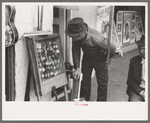 Man looking at cases of watches. Waco, Texas