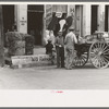 Activity around farmers' supply store. Market square, Waco, Texas