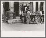 Activity around farmers' supply store. Market square, Waco, Texas