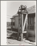 Bell on cattle Ranch near Spur, Texas. This is used to awake the cowboys in the morning, call them to the ranch house telephone, and announce meals