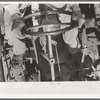 Day laborer on tractor on large farm near Ralls, Texas