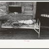 Child afflicted with tuberculosis of the spine in cast on porch of his home near Warner, Oklahoma. Tenant farm family