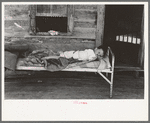 Child afflicted with tuberculosis of the spine in cast on porch of his home near Warner, Oklahoma. Tenant farm family