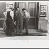 Men in front of bank, Frederick, Oklahoma