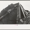 Detail of construction of roof of house of white tenant family. Notice the rags stuffed in under the shingles to keep out cold and rain. McIntosh County, Oklahoma