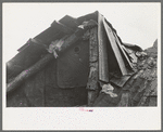 Detail of construction of roof of house of white tenant family. Notice the rags stuffed in under the shingles to keep out cold and rain. McIntosh County, Oklahoma