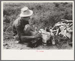 Itinerant statue maker putting together the pieces of a mold for one of his statues. He had been at one time an oil field worker. He said that the WPA (Work Projects Administration) had reduced the possibility of the man on the road getting a job