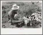 Itinerant statue maker putting together the pieces of a mold for one of his statues. He had been at one time an oil field worker. He said that the WPA (Work Projects Administration) had reduced the possibility of the man on the road getting a job