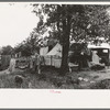 Camp of itinerant statue maker and agricultural day laborer on Poteau Creek near Spiro. Sequoyah County, Oklahoma