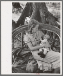 Wife and child of itinerant cane furniture maker and agricultural day laborer camped in Wagoner County, Oklahoma